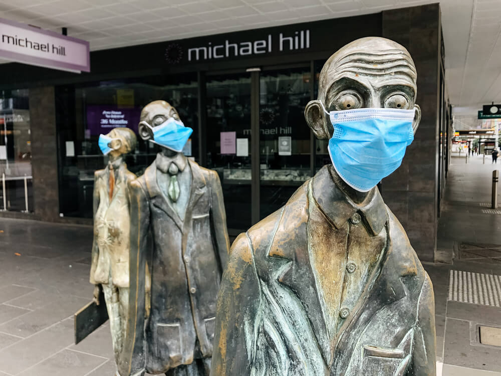 AUD three famous statues in Downtown Melbourne don facemasks for the pandemic Melbourne Victoria Australia
