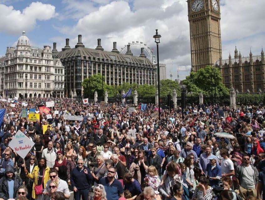 People standing out in protest against brexit