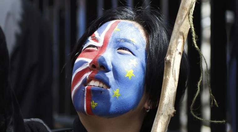 A woman looks upwards during a demonstration against Britain's decision to leave the European Union, in central London A woman looks upwards during a demonstration in BREXIT