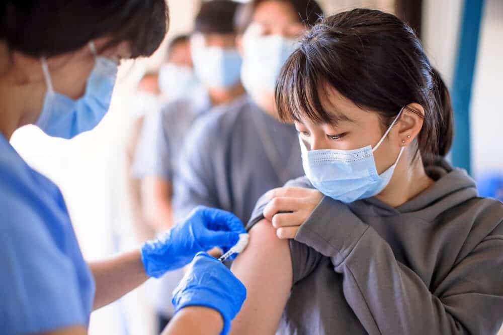 coronavirus injection to group of people