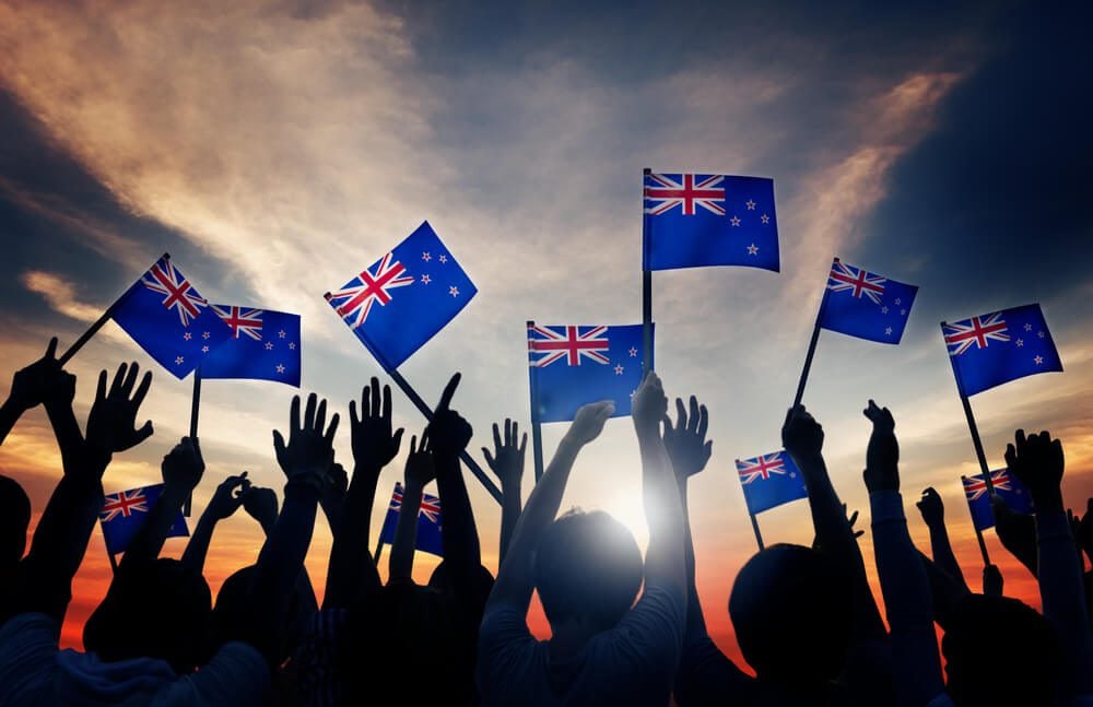 People Holding Flag of New Zealand