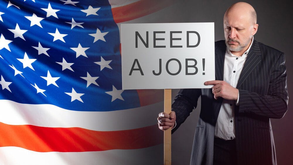 US Unemployment Sad man with a poster about job search