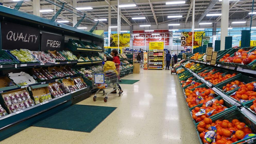 UK Shoppers browse an aisle in a Tesco supermarket. Britains Tesco is the worlds third largest supermarket