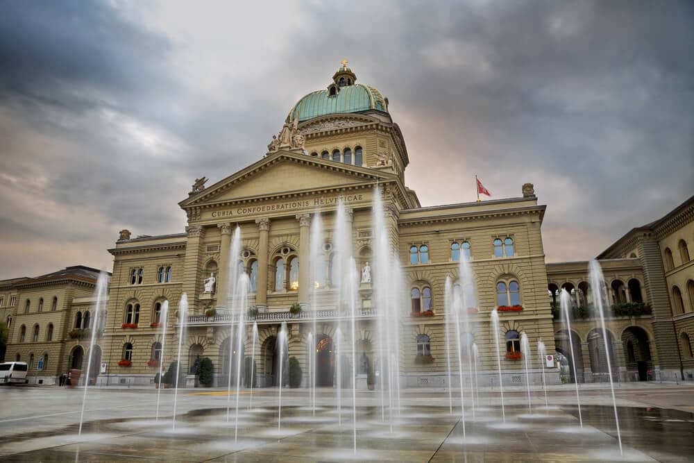 Swiss Parliament building through fountain. Bern.Switzerland