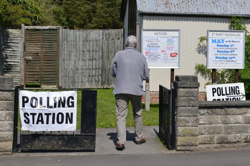 GBP A voter visits a polling station at a church. Voters are electing members for Scottish Parliament Welsh Assembly Northern Ireland Assembly and English Local Councils.