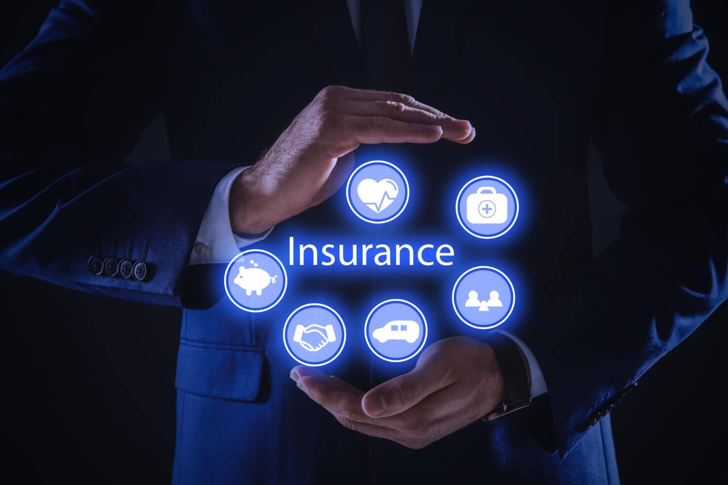 businessman holding different icons dark background closeup insurance concept (1)