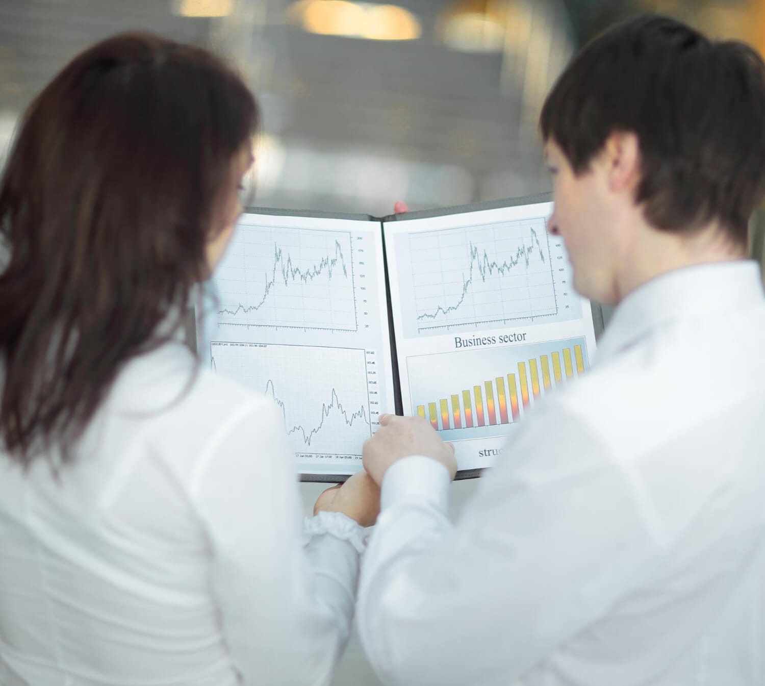 rear viewcloseup business colleagues analyzing financial charts (1)